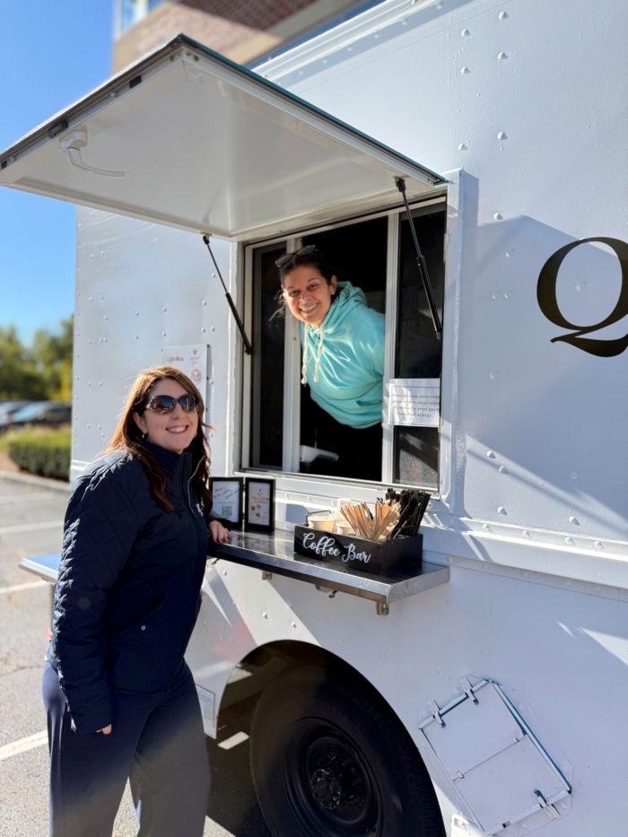 Employee getting coffee from coffee truck