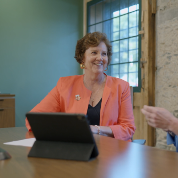 Karen with ipad in office