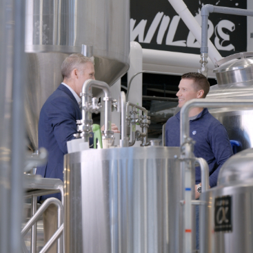 Jeff and Justin talking in the brewery