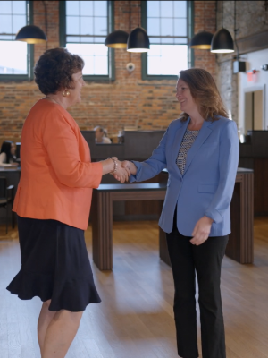 Lowell Five employee and community partner shaking hands