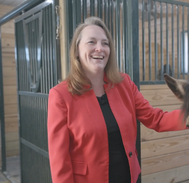 Woman standing and smiling